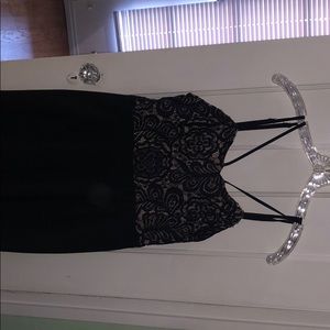 Black jumpsuit with strappy lace top